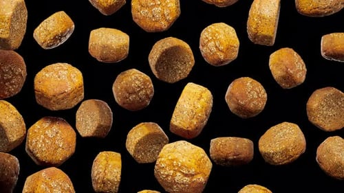 Seamless Animated Baked Bread Pieces Falling on Black Background