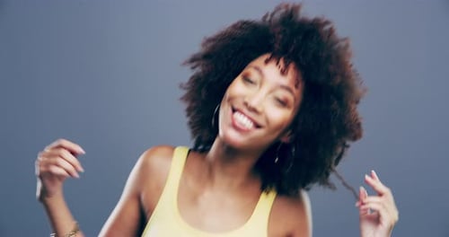 Woman with Curly Hair Smiles and Dances