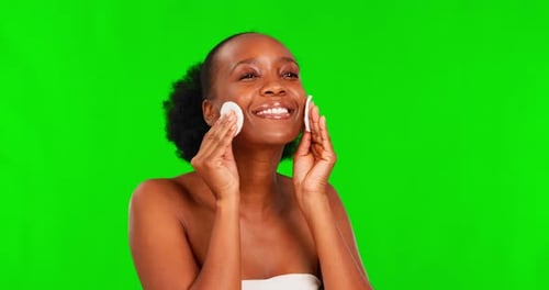Beauty, black woman and green screen with cotton pad for skincare glow and dermatology