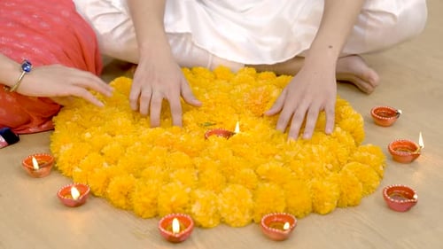 Creating Diwali Flower Rangoli with Lamps