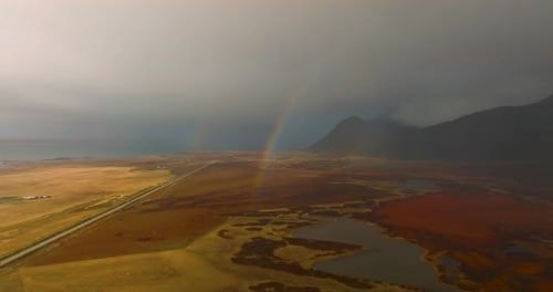 aerial scenic iceland landscape with rainbow, lakes and mountains on background