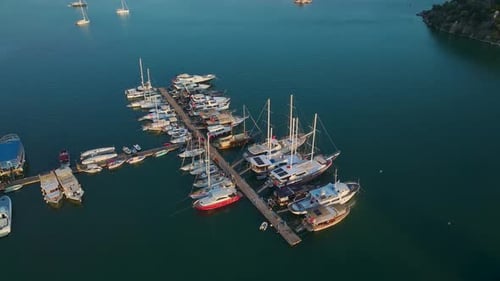Aerial View Quaint Tourist Village By the Sea With a Calm Waterfront Full of Yachts