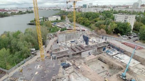 Concrete Structures and Metal Reinforcements Fill Site of Construction Project