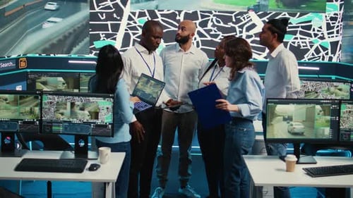 Diverse Team Collaborating in Modern Surveillance Office