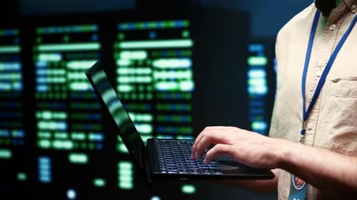 Man Working at Night on Laptop