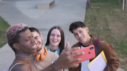 High Angle View of a Multiethnic Group of Friends Taking a Selfie Outdoors