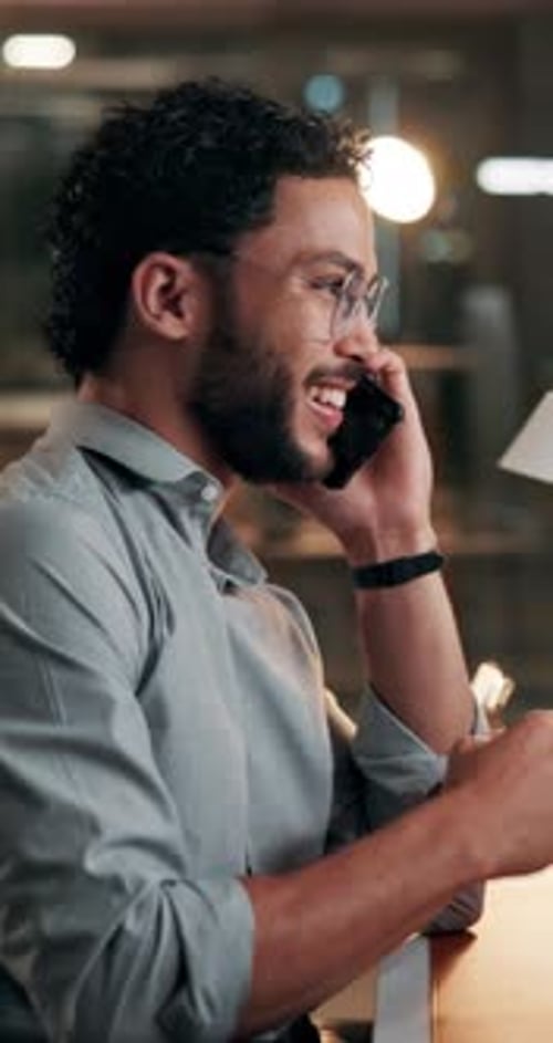 Phone call, happy and businessman in office at night for finance negotiation with budget review