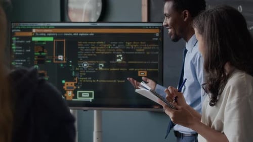 Black Male Teacher Giving Programming Lesson to Class