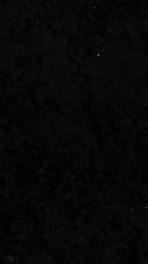 Vertical Retro Cinematic Grunge Overlay with Dusty Surface and Scratches