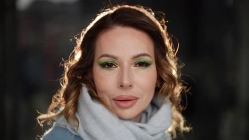 Woman with Green Eyeshadow Posing Outdoors