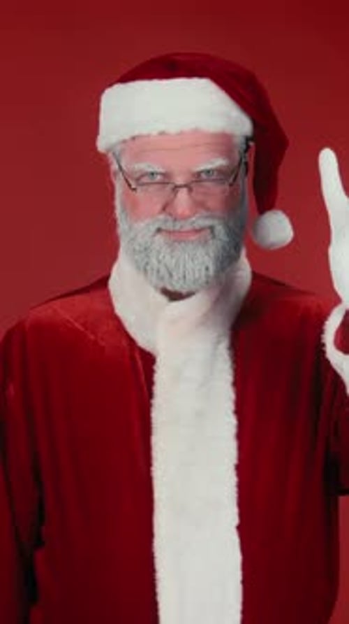 Cheerful Santa Waving and Shooting Confetti