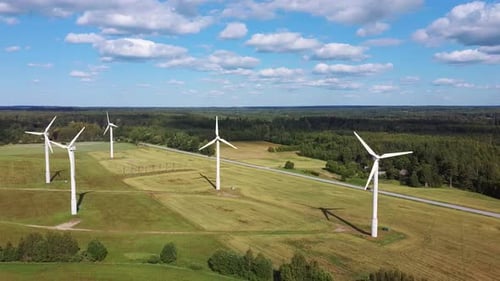 Aerial View of Wind Farm or Wind Park, With High Wind Turbines for Generation Electricity 4K UHD