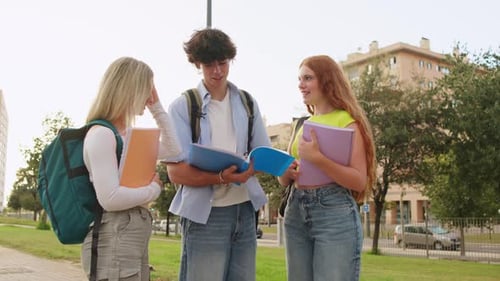 University Students Chatting and Smiling Outdoors