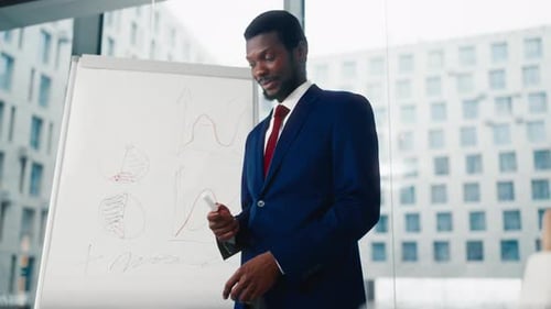 Business Coach Performing in Office Teaching Businessmen or Professionals African American Man