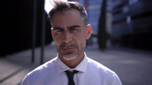 Serious Man Stares in Urban Outdoor Close Up