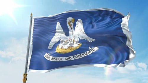 Louisiana State Flag Waving Against a Clear Blue Sky