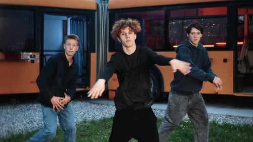 Talented Young Adults Dancing Rhythmically in an Urban Space
