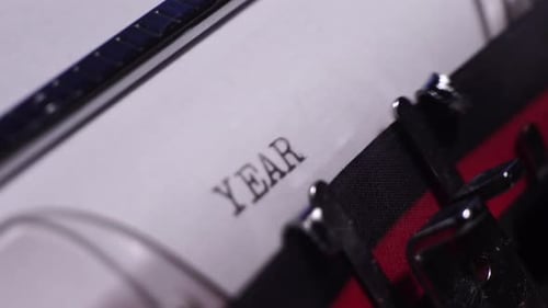 Year 1929 Typing on White Paper in Vintage Typewriter, Close Up