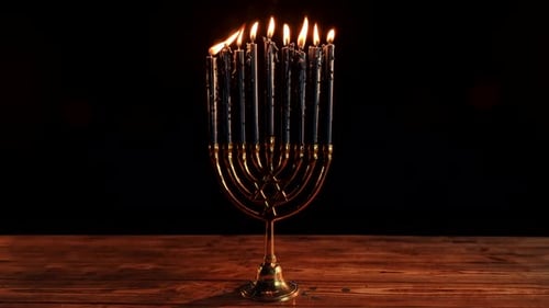 Hanukkah Menorah with Burning Candles on Wooden Table