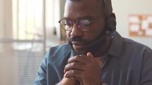 Call Center Worker Talking to Client