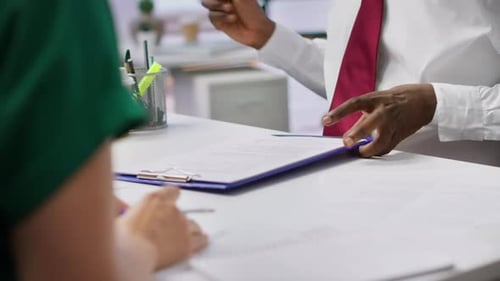 Job Interview Candidate Signing His Employment Contract at the Office