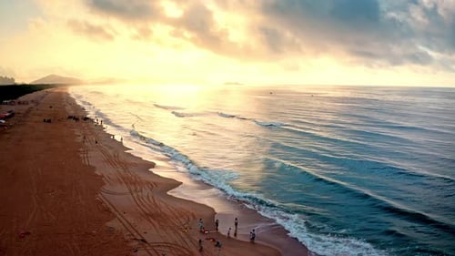 Aerial Top view of a transparent blue sea with beautiful waves at sunny day in summer. air of ocean