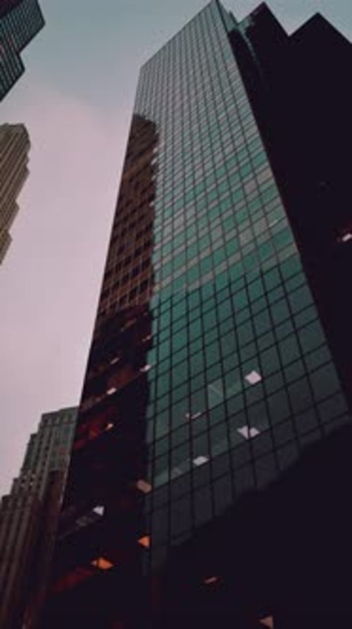 Looking Up at a Tall Building With Many Windows