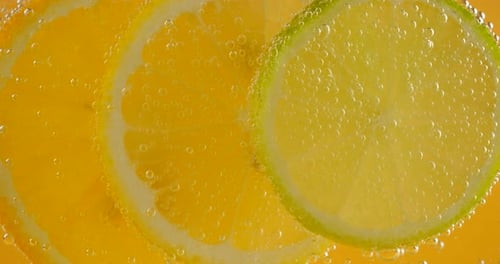 Refreshing Citrus Slices with Bubbles, Macro Close Up
