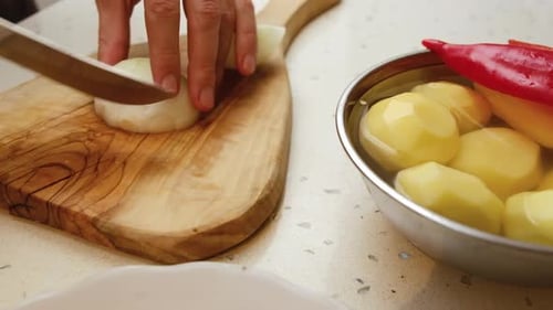 Cutting Onion on a Cutting Board