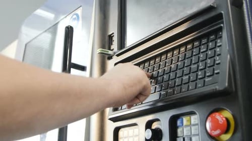 Engineer Sets Program on Modern Machine Control Panel