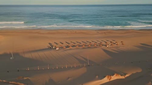 Panoramic View Tropical Beach Ocean Surf Aerial Empty Recliners and Umbrellas