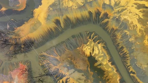 Surreal aerial view of colorful chemical mine waste waters