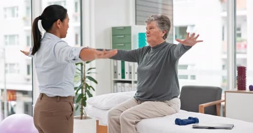 Senior Woman in Physical Therapy with Therapist