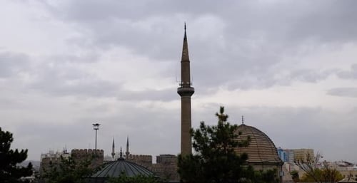 Minaret of a Historical Mosque and Timelapse Clouds