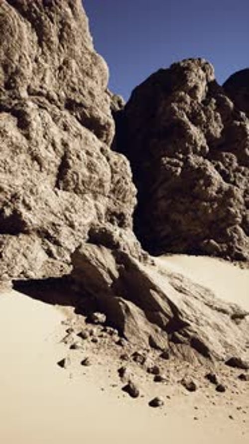 Massive Rock Formation Amidst Desert Landscape