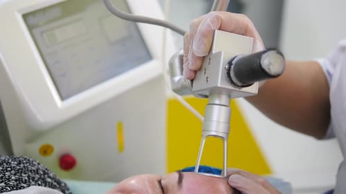 Fractional Laser CO2 Procedure Cosmetic Treatment in Beauty Clinic Woman Having Laser Skin Treatment