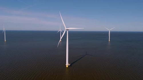 Exploring the Majestic Wind Turbines of the Netherlands Across Tranquil Waters