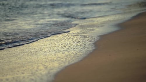 Yellow Sand Against The Backdrop Of Sea Foam Waves