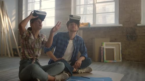 Couple Experiences Virtual Reality Using VR Headsets
