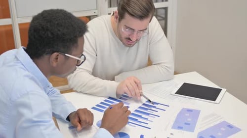 Close up of Business People Working on Documents
