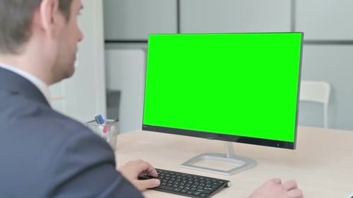 Businessman Using Desktop with Green Screen
