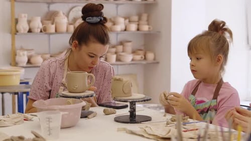 Mother and Daughter Pottery Workshop in a Bright Art Studio