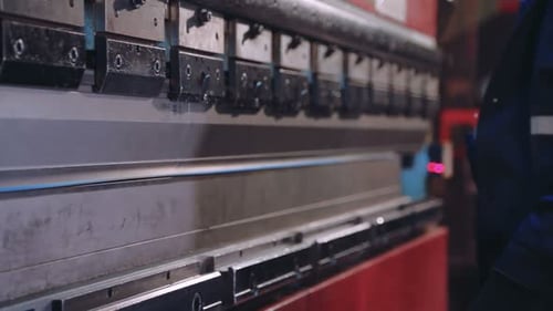 Worker Hands Bend Metal Sheet On A Modern Bending Industrial Machine At A Factory. Processing Of ...