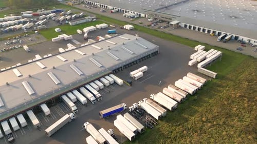 Aerial view of goods warehouse. Logistics center in industrial city zone from above. Aerial view of