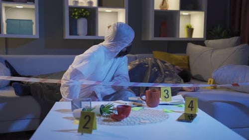 Investigator Inspecting Gun at Crime Scene at Night