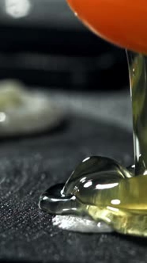 The Broken Egg Falls Into the Pan Filmed on a Highspeed Camera at 1000 Fps