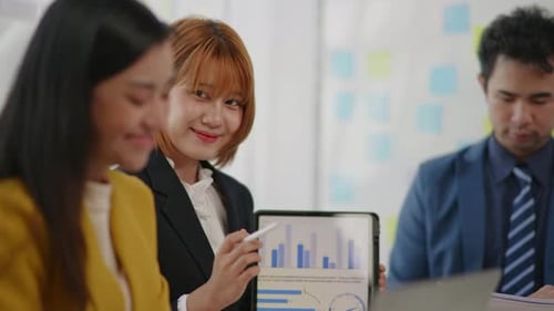 Business Meeting and Data Analysis in Modern Office