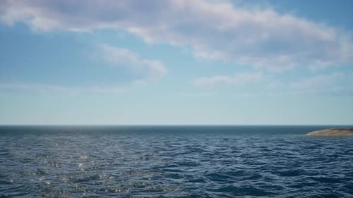 Calm Blue Ocean Under A Partly Cloudy Sky Horizon View