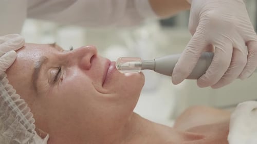 Facial Treatment with Wand in Beauty Clinic