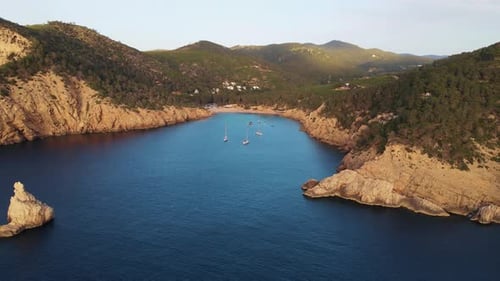 Aerial view of the bay in Cala Benirras, IBIZA, during sunset.